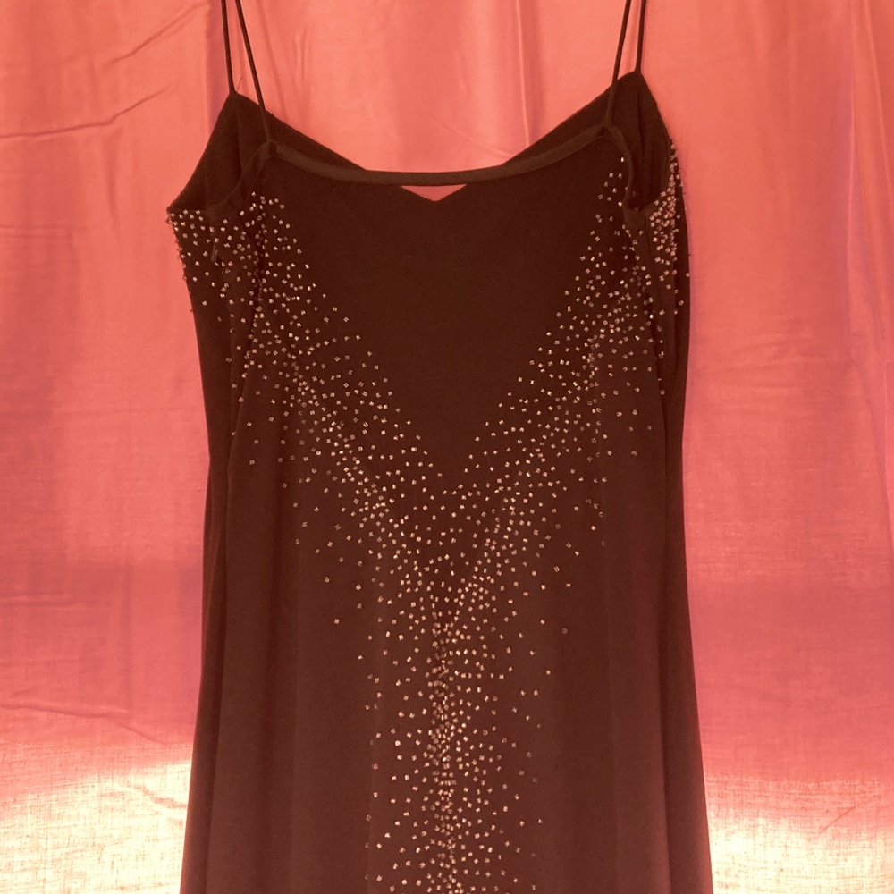 Spaghetti strap black prom dress.